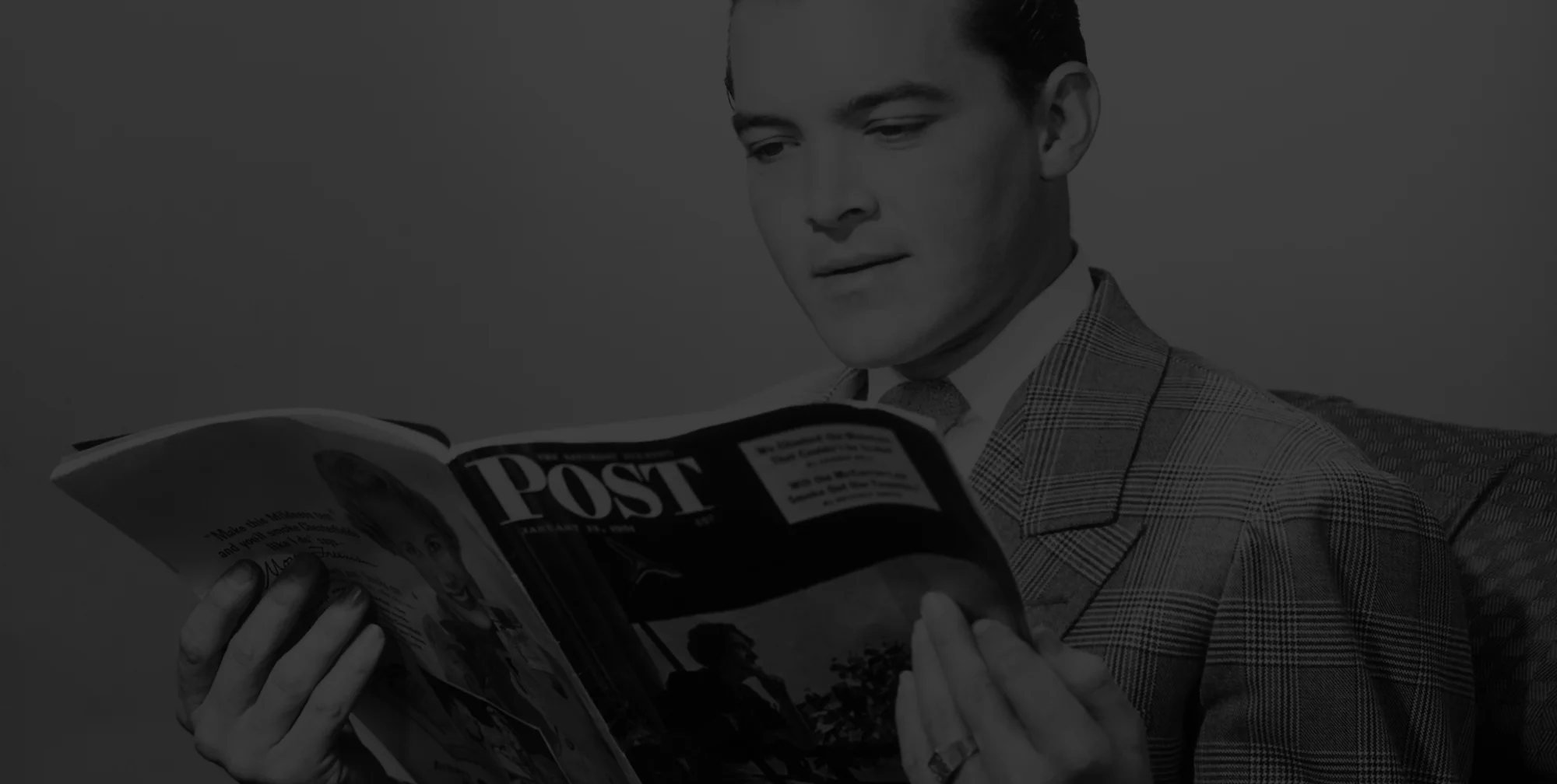 Man looking at a brochure